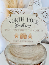 Load image into Gallery viewer, North Pole Bakery Hanging Sign
